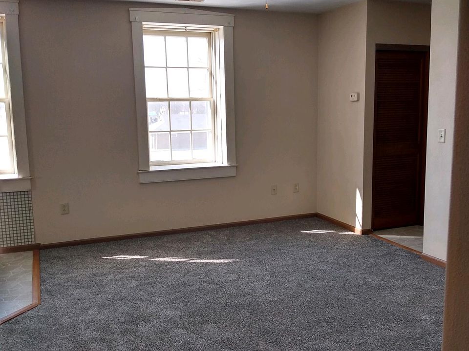 NEWLY PAINTED AND NEW CARPET IN THE LIVING ROOM