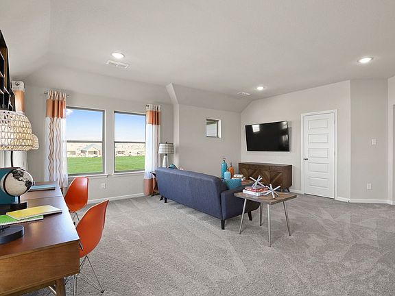 Game room in the Masters home plan by Trophy Signature Homes - REPRESENTATIVE PHOTO