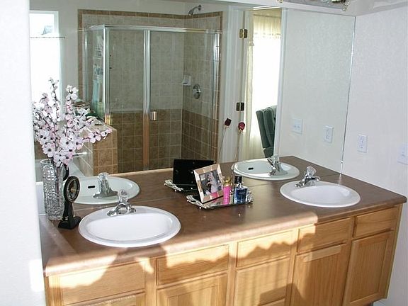 Master features 5 piece bath and walks out to deck