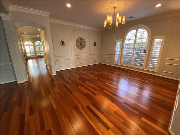 Gorgeous Formal Living Room with huge windows and tons of wonderful decorative details.