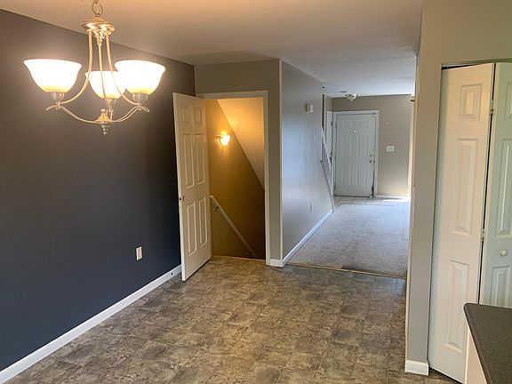Dining room looking into living room and basement stairwell