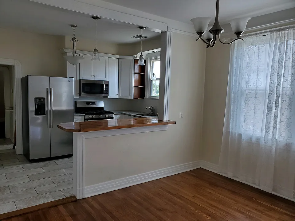 Wood bar with Kitchen open to Living Room