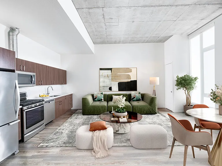 A bright apartment home with concrete ceilings, expansive windows, and an open kitchen layout that allows space to shape around your lifestyle.