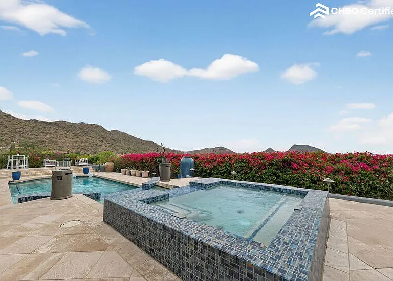 Cold plunge pool with waterfall & mountain views