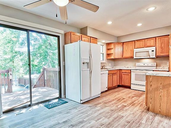 Kitchen with New floors, countertop and dishwasher. LED lights