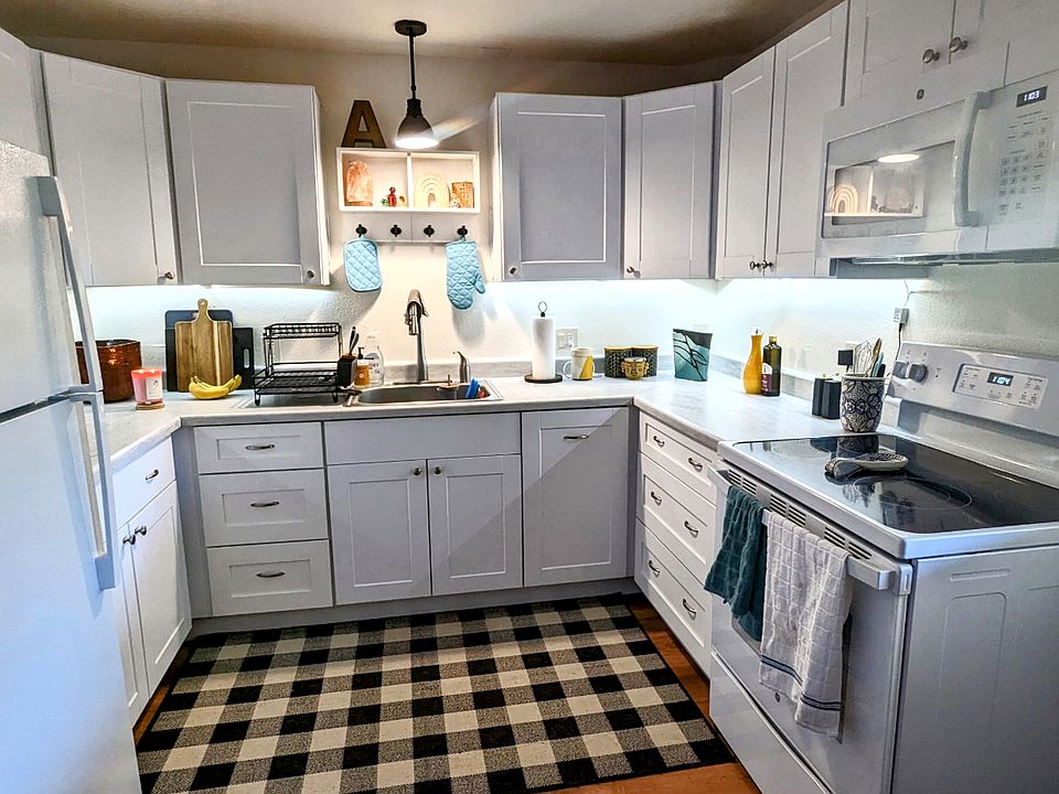 Kitchen with new cabinets and upgraded appliances. (furnishings not included)