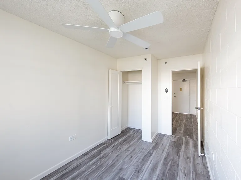 Bedroom #2 with bright finishes and convenient closet space.