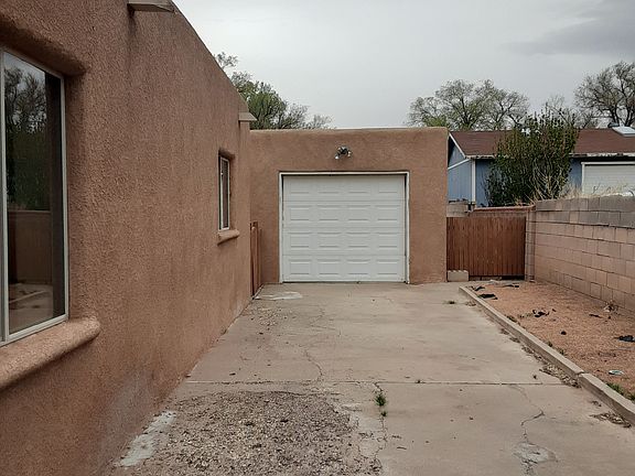 Driveway with detached garage on eastside of house.