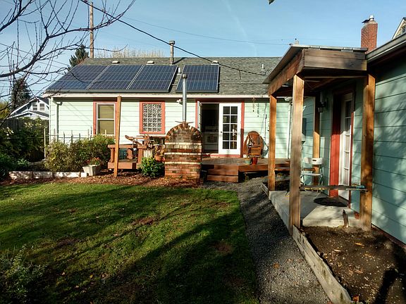 Backyard view of deck, solar and ADU