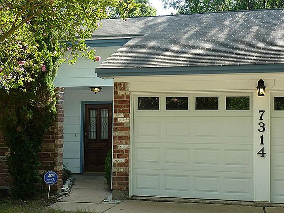 Front entry through a small courtyard