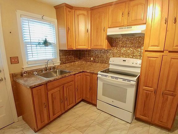 Kitchen with back door to deck.
