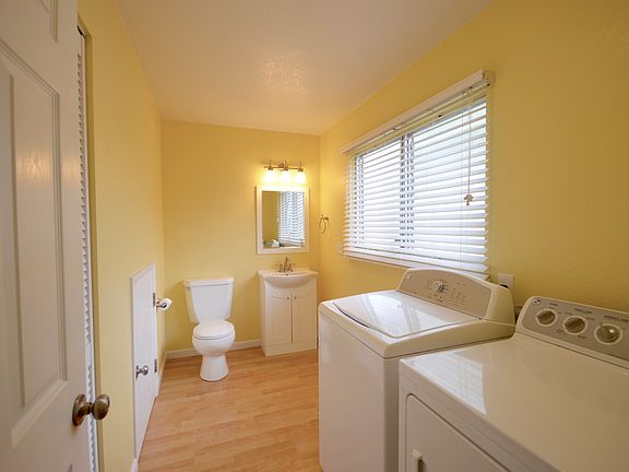 Downstairs half bath with ample storage