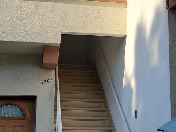 Stairs lead to the unit, no neighbor below