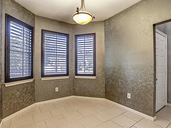 Large bay windows with plantation shutters