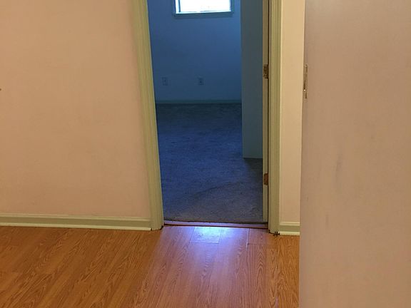 dining area looking into one of two bedrooms