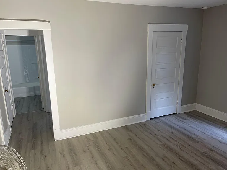 Living room with a view of the hallway.