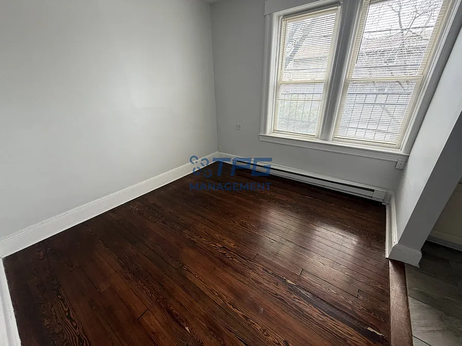 $500 off the first month's rent | Bright & Updated 1BR in Bayonne | Hardwood Floors | Vintage Cha... — Photo 2