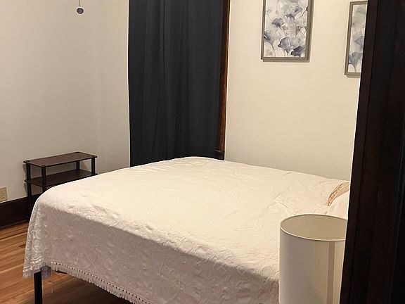 Primary bedroom with blackout curtains. Queen size bed.