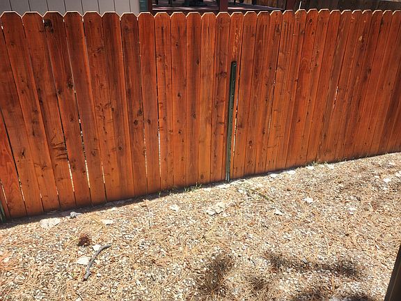 Fenced yard- all gravel and rock