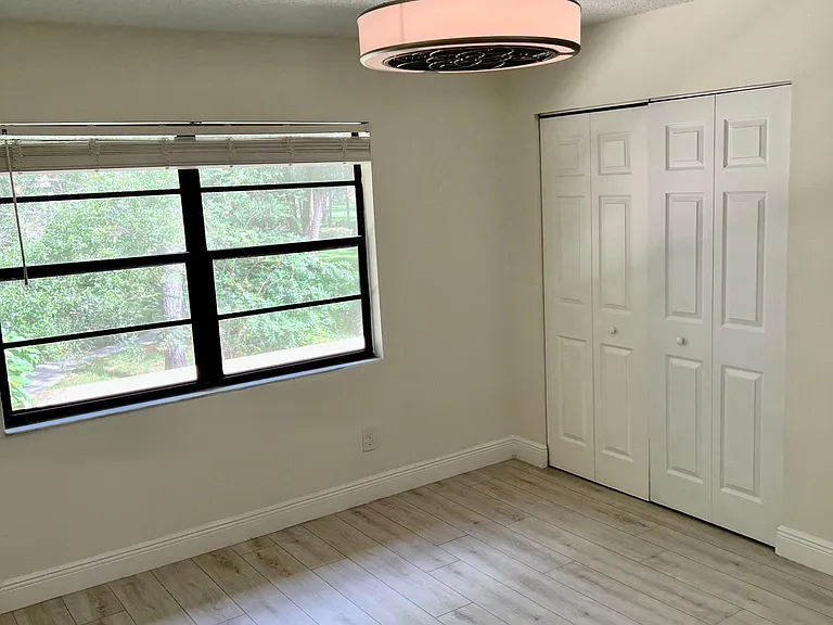 Primary bedroom with double closets.