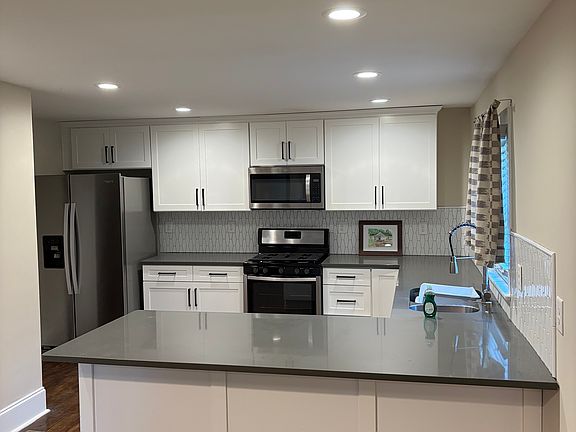 Spacious kitchen with walk in pantry.