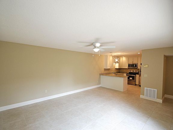 Large family room. Upgraded flooring, lighting, and kitchen.