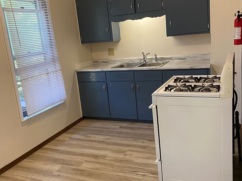 New floor and countertop, freshly painted walls, ceiling and cabinets.