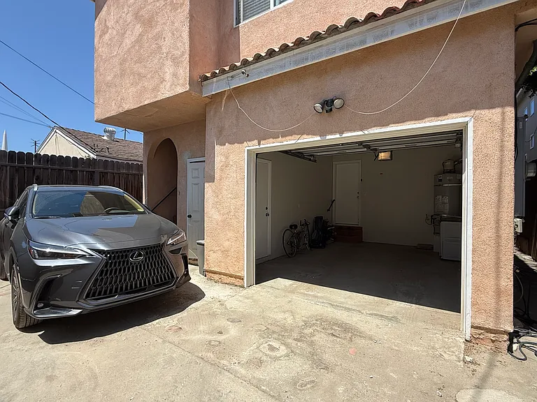 Private Garage. Upstairs unit parks outside.
