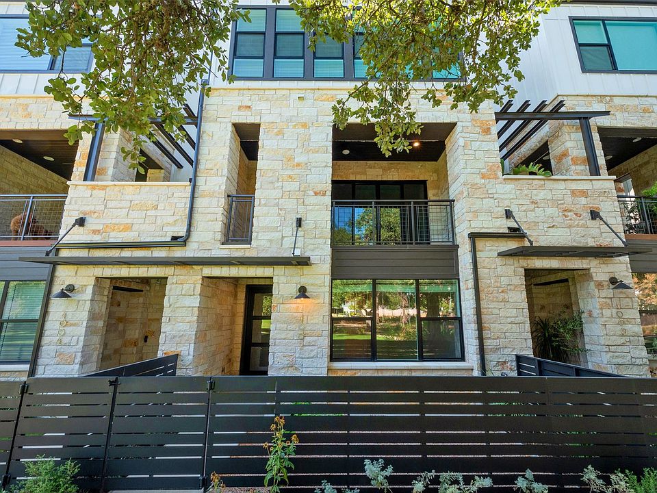 Front of the home features a cozy fenced in gravel yard for easy maintenance.