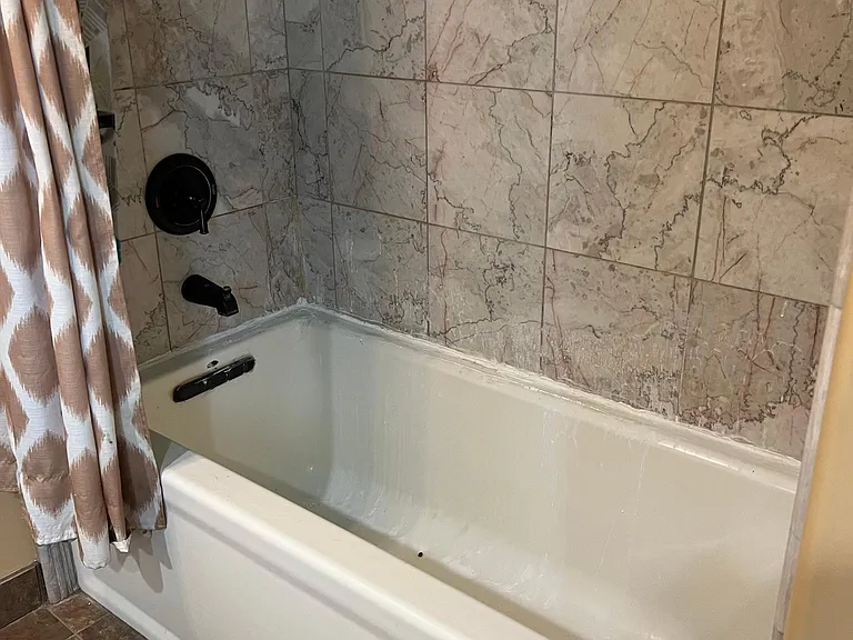 soaking tub marble surround