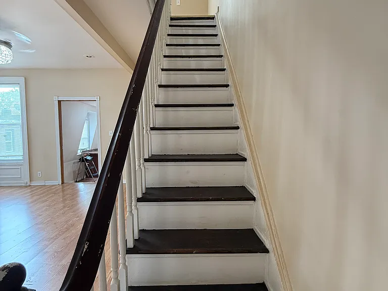 stairs to 3rd floor that has 2 bedrooms w full bath