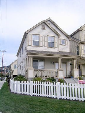 Front of house with white picket fence 