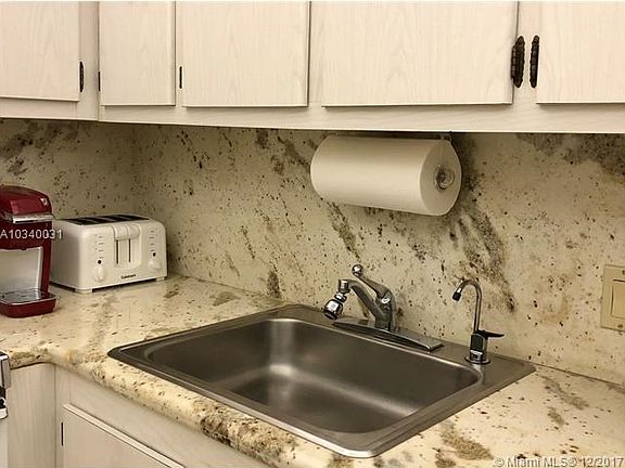 Kitchen has granite countertops