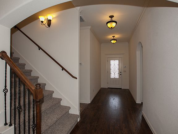 Entry has distressed hardwoods