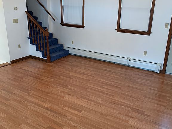 Living room from front door, facing stairs to second bedroom & loft.