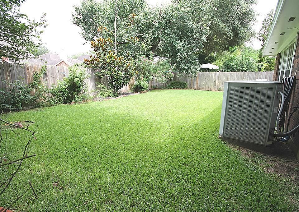 Lovely backyard with beautiful landscaping all around!