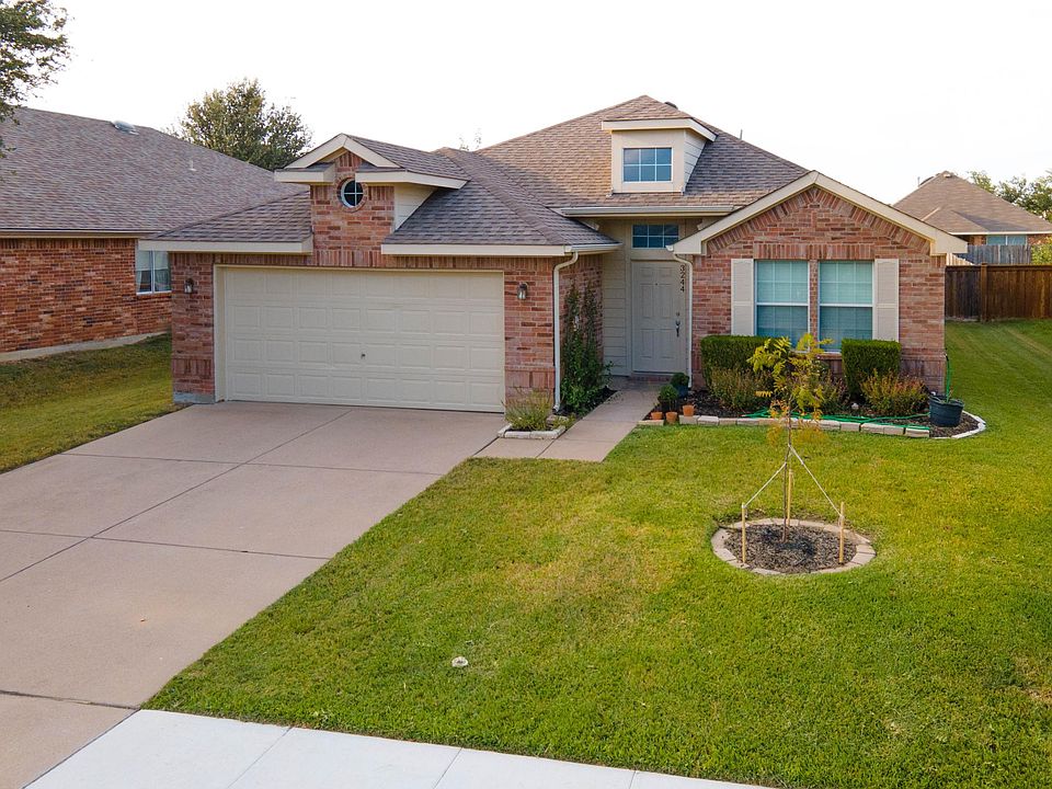 Well taken care landscape and two car garage