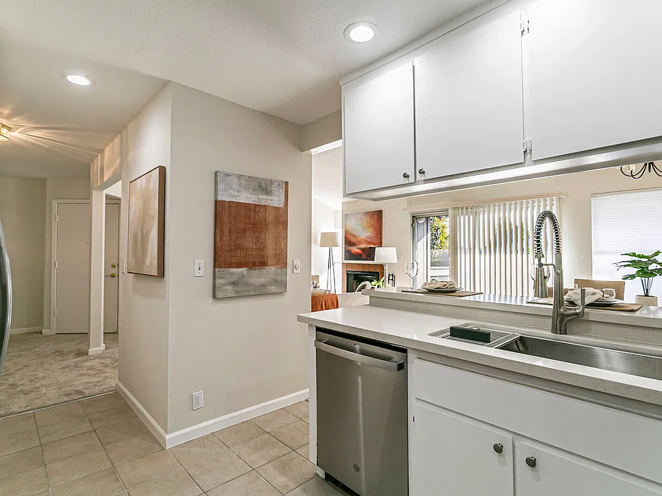 Kitchen opens to dining area and living room.