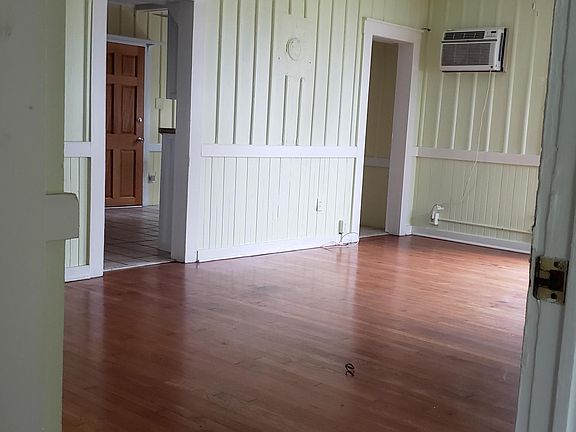 Living room with hardwood flooring.