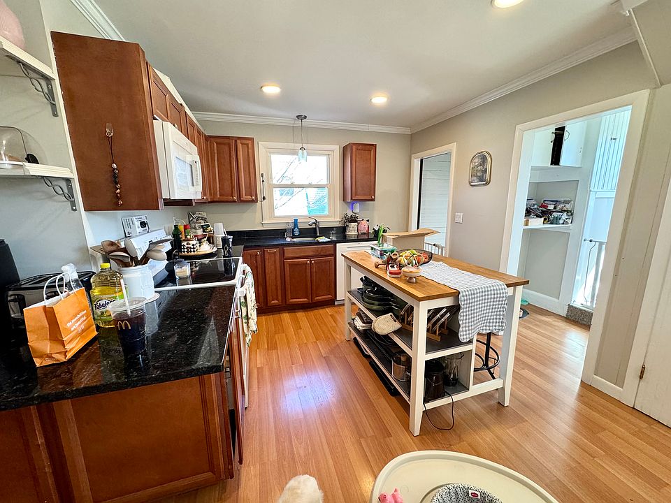 Kitchen with a walk-through pantry leading to the back stairway to the second floor.