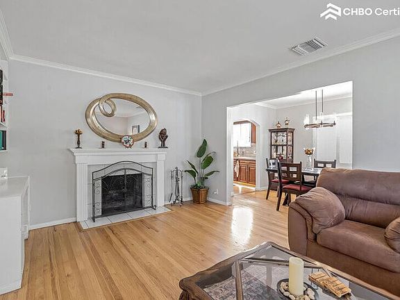 Living room with wood burning fireplace