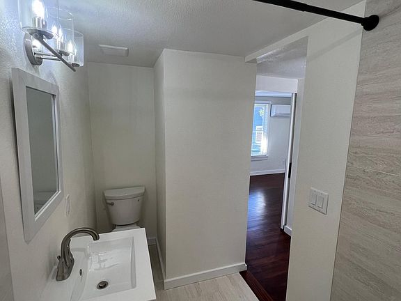 Modern bathroom with FANTASTIC lighting! Beautiful tile floors throughout. 

Huge shower!