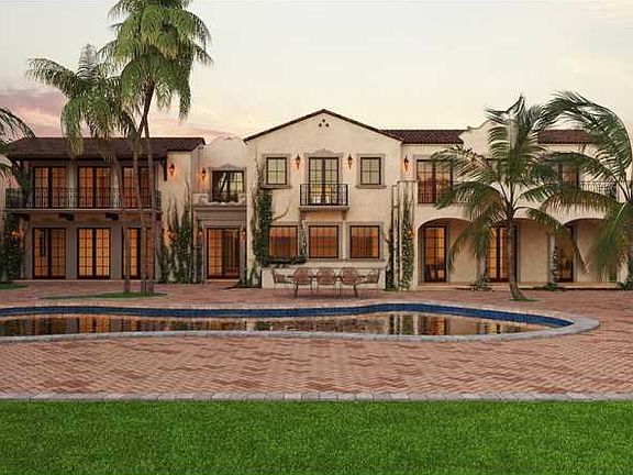 Great opportunity to own an incredible pie-shaped waterfront Mediterranean estate on Lower North Bay