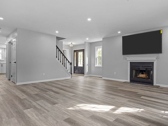 Lounge/Living Room with log fireplace & T.V.
