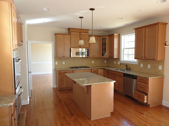 Gourmet kitchen has double ovens & gas cooktop, lots of cabinet/counter space 