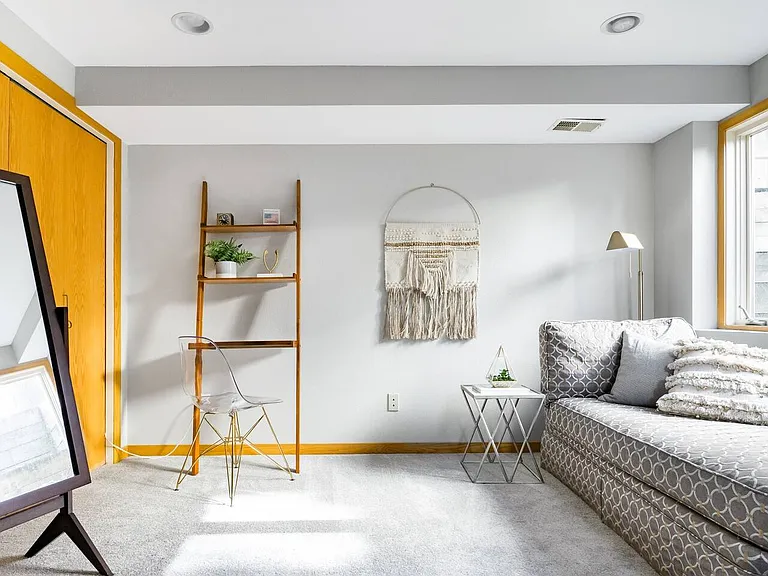 South East basement bedroom with lounging area and desk