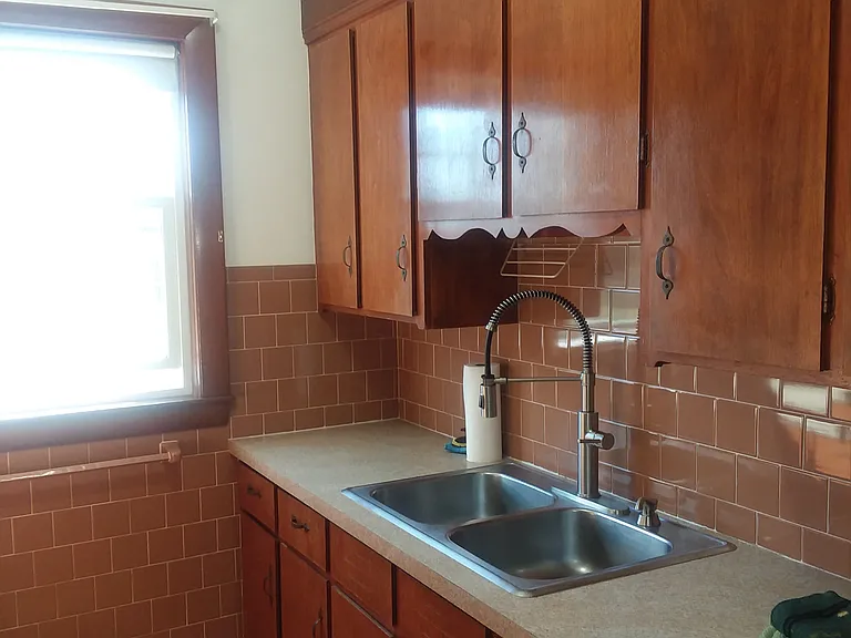 Pantry has plenty of Cabinets on both sides top to bottom.