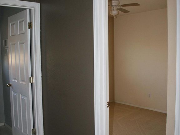 Three bedrooms on second floor each with ceiling fan.