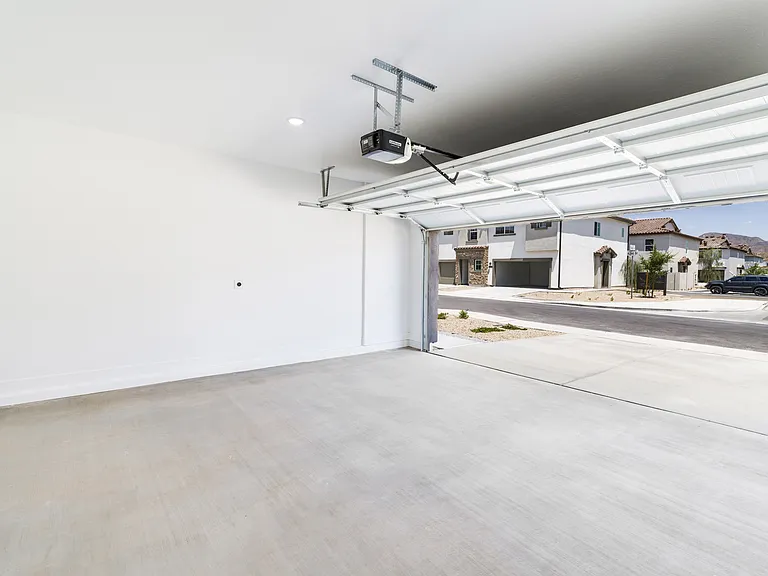 Discover the convenience of upscale living at Amavi Aster Ridge, where 1- and 2-car front garages, along with driveways, provide ample parking and storage space right at your doorstep.