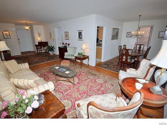 Living room opens to the entry foyer and "L" shape dining room.